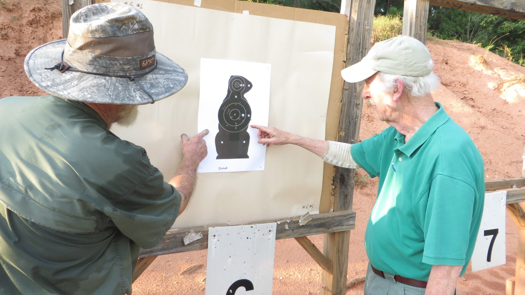 Bill and Doyle admire Doyle's 100 yard target.  Definitely some impressive handgun shooting there!